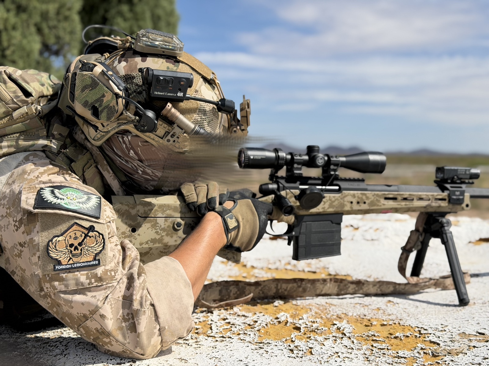 Airsoft player moving through an outdoor field position.
